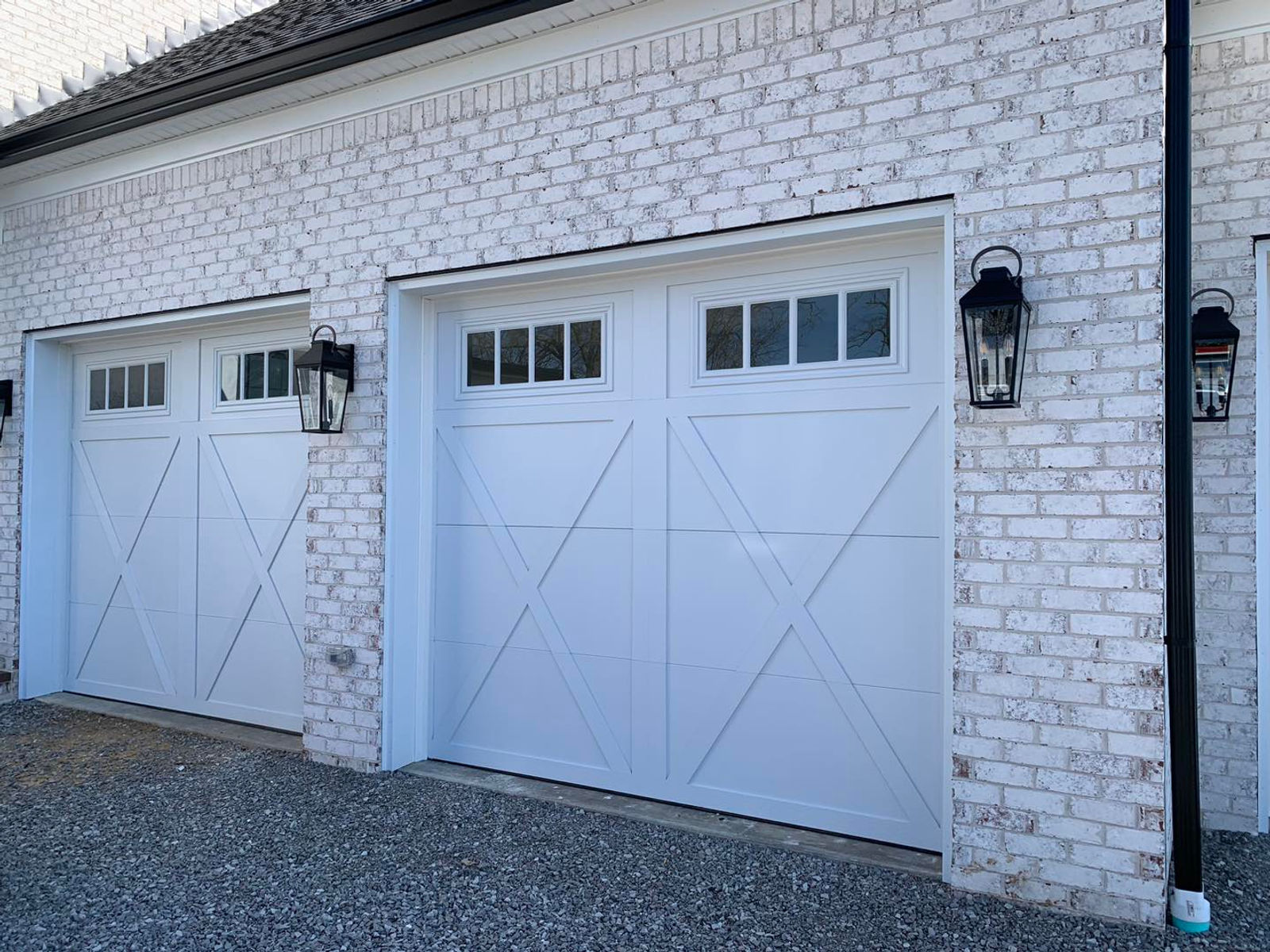 Carriage-style garage doors installed for a happy EZ Open customer