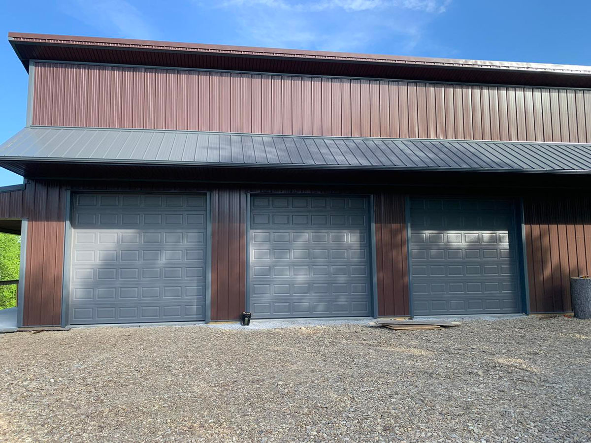 Three-bay barn garage doors installed in rural Kentucky